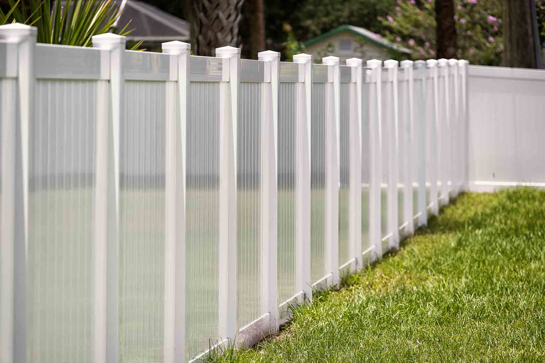 White vinyl privacy fence with post caps